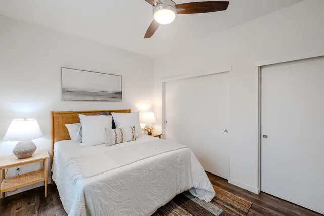 a bedroom with a bed and a window