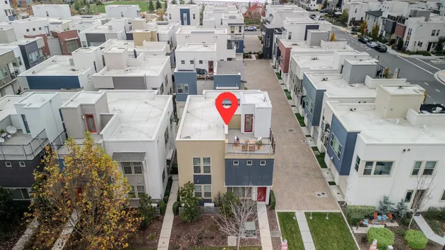 a view of multiple houses with outdoor space