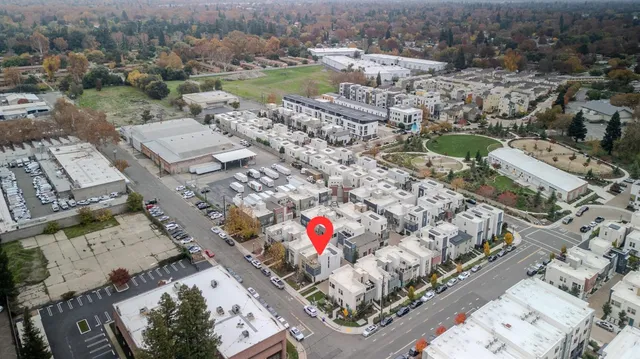 an aerial view of residential houses with outdoor space