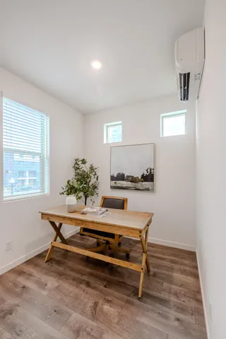 a living room with furniture and a potted plant