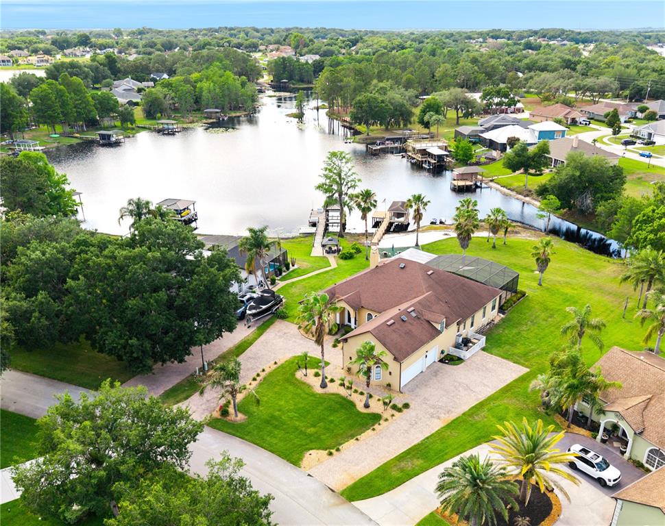 11325 Preston Cove Road Clermont, FL 34711 - Photo 7 of 58 an aerial view of a house with garden space and lake view