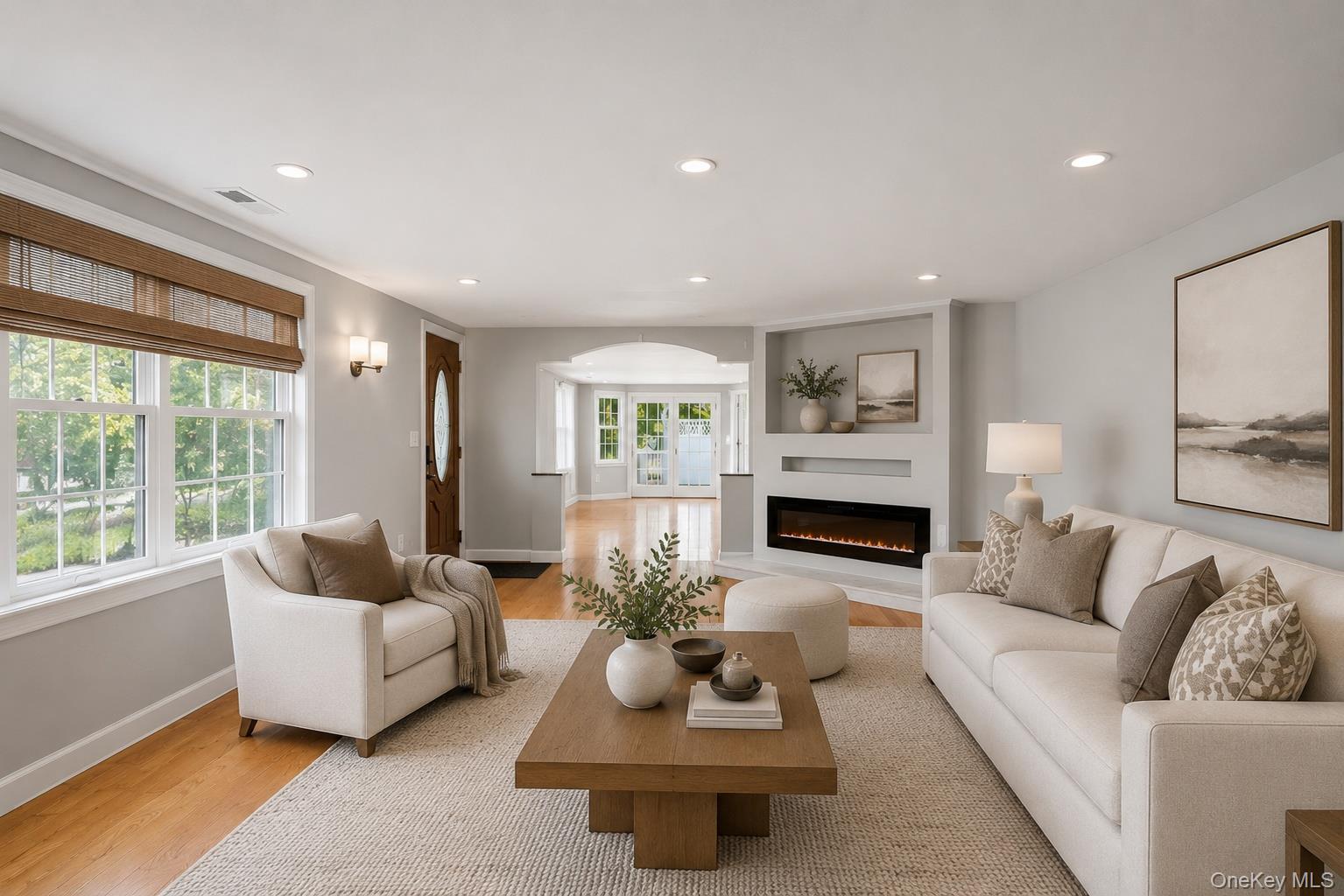 12 Leeside Road Carmel, NY 10512 - Photo 7 of 44 Bright living space featuring wood-finish flooring, recessed lighting, and an integrated electric fireplace with shelving above