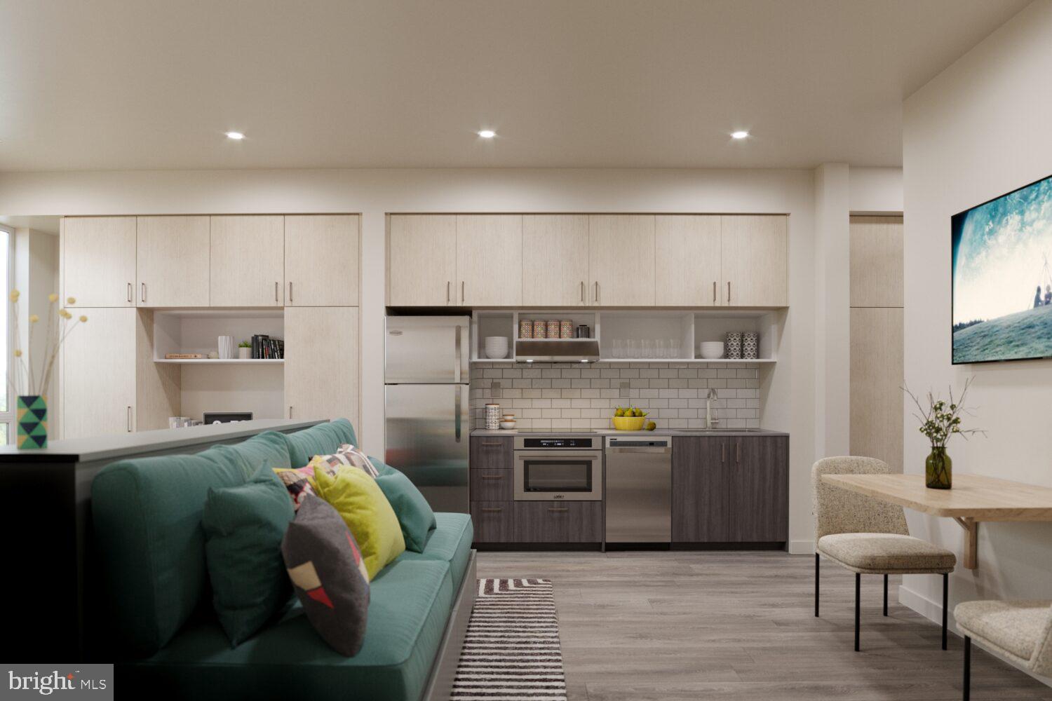 1314 Spring Garden Street, Unit 610 Philadelphia, PA 19123 - Photo 6 of 26 a living room with stainless steel appliances furniture and a kitchen view