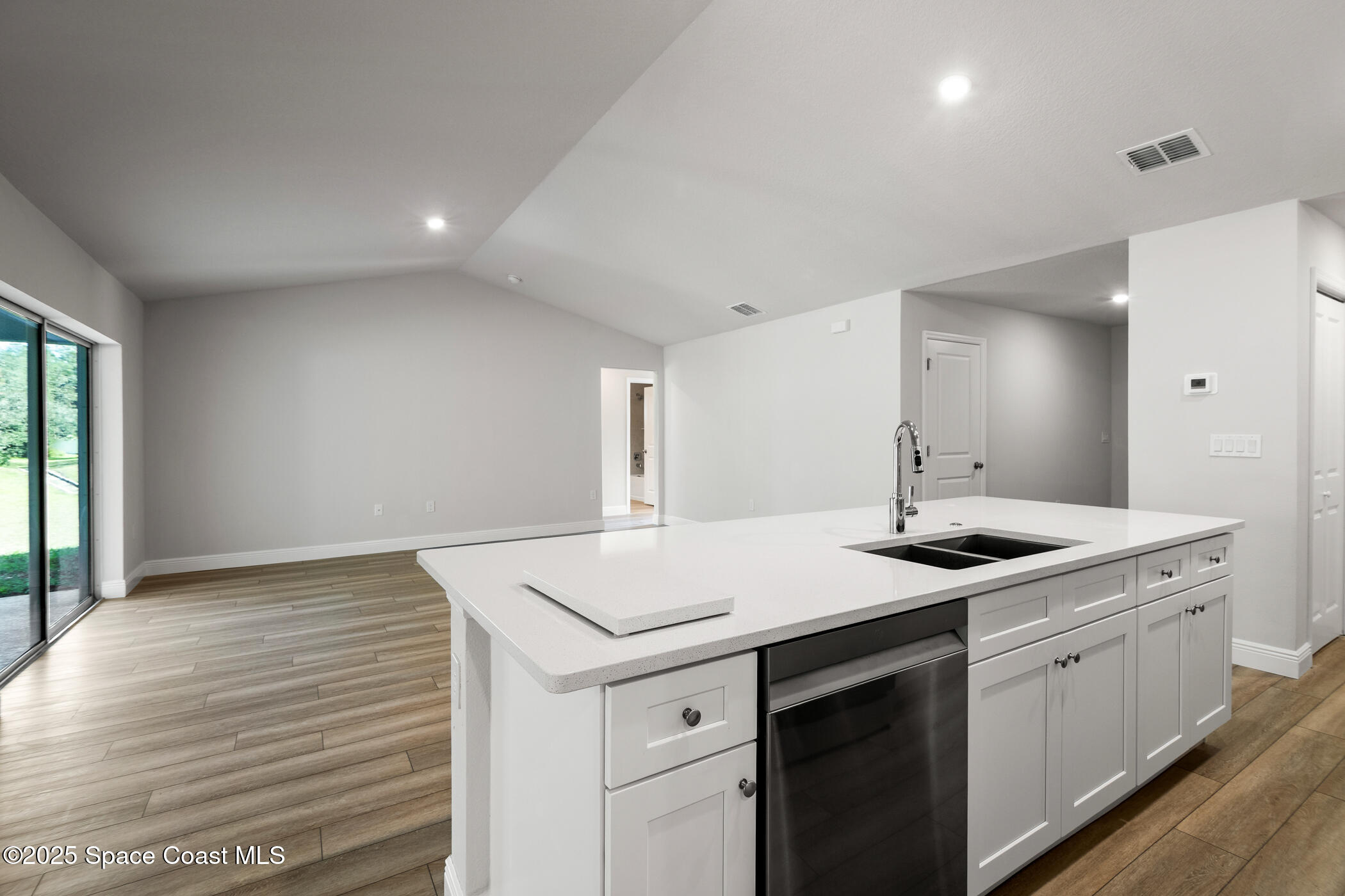 5435 Southeast 91st Street Ocala, FL 34480 - Photo 18 of 44 a kitchen that has a sink and a stove in it