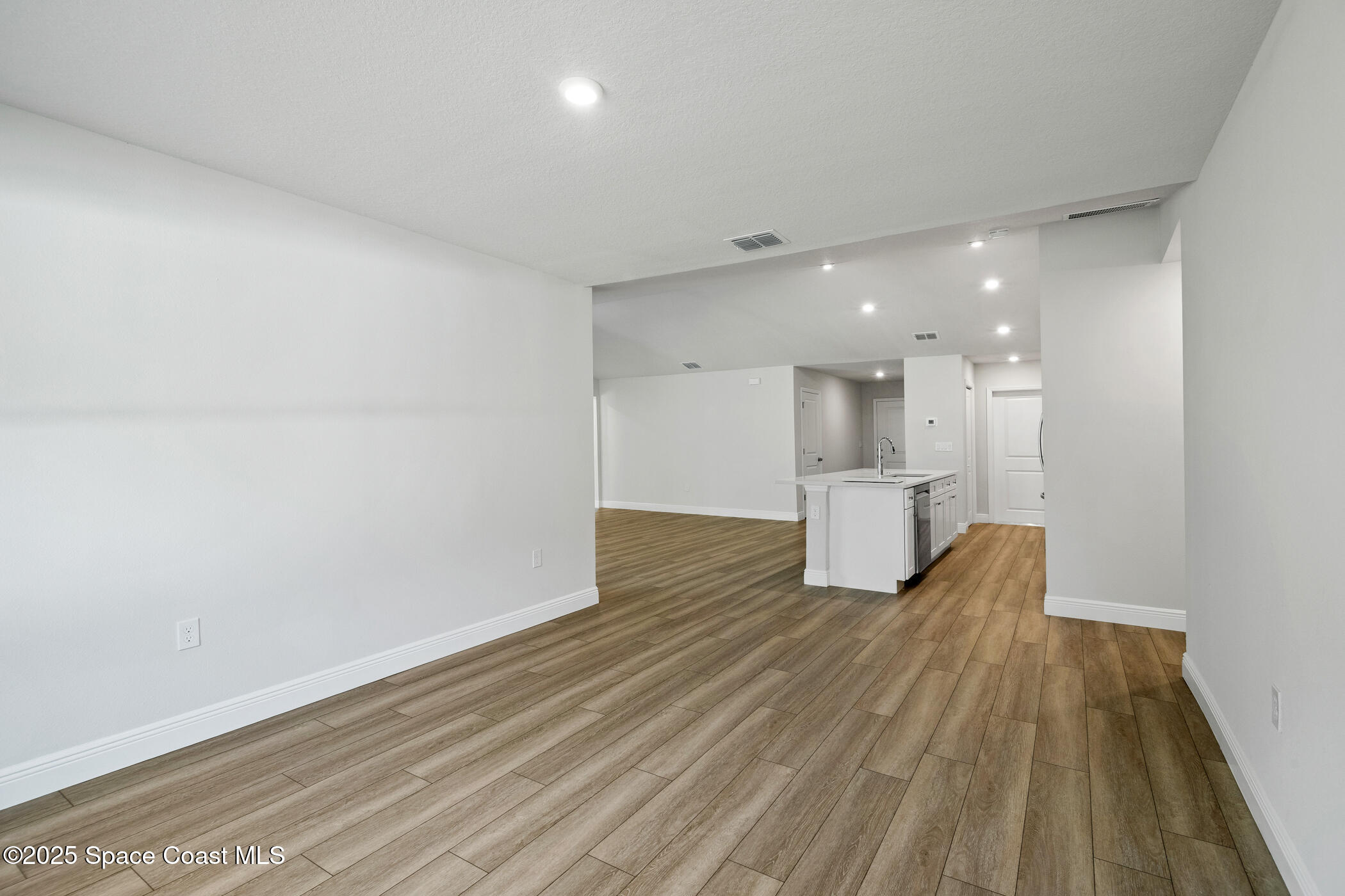 5435 Southeast 91st Street Ocala, FL 34480 - Photo 20 of 44 a view of empty room with wooden floor