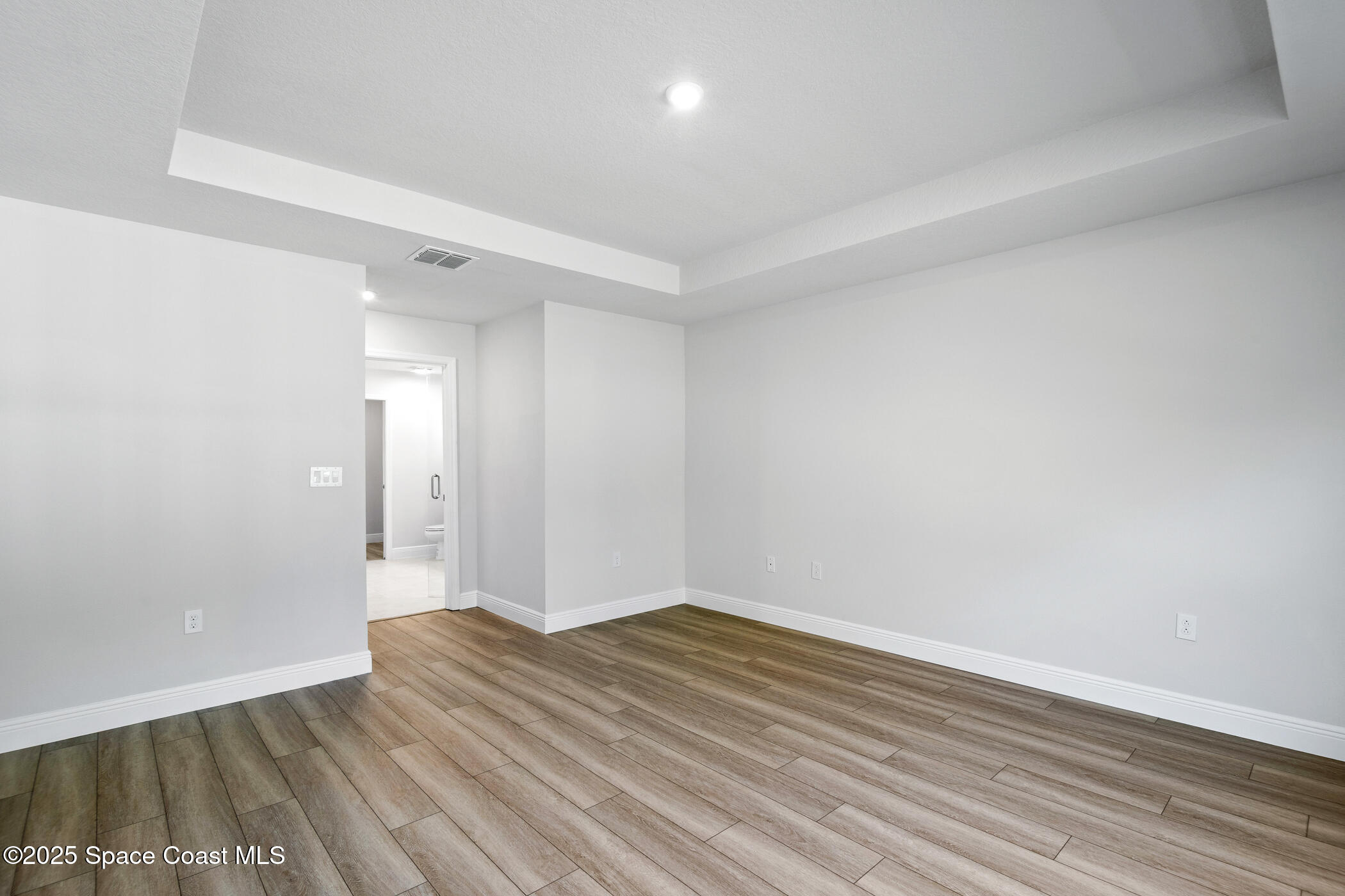 5435 Southeast 91st Street Ocala, FL 34480 - Photo 23 of 44 an empty room with wooden floor and windows