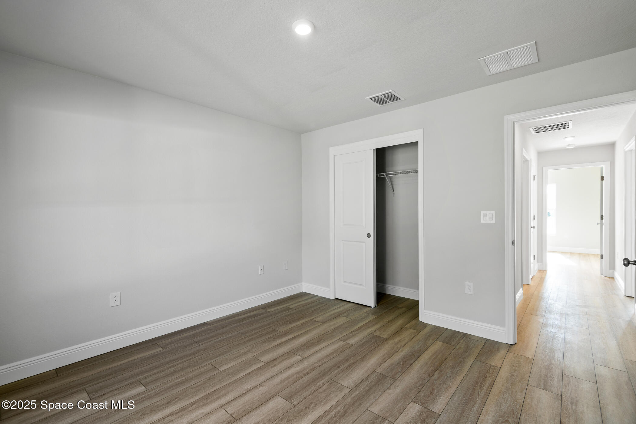 5435 Southeast 91st Street Ocala, FL 34480 - Photo 30 of 44 wooden floor in an empty room
