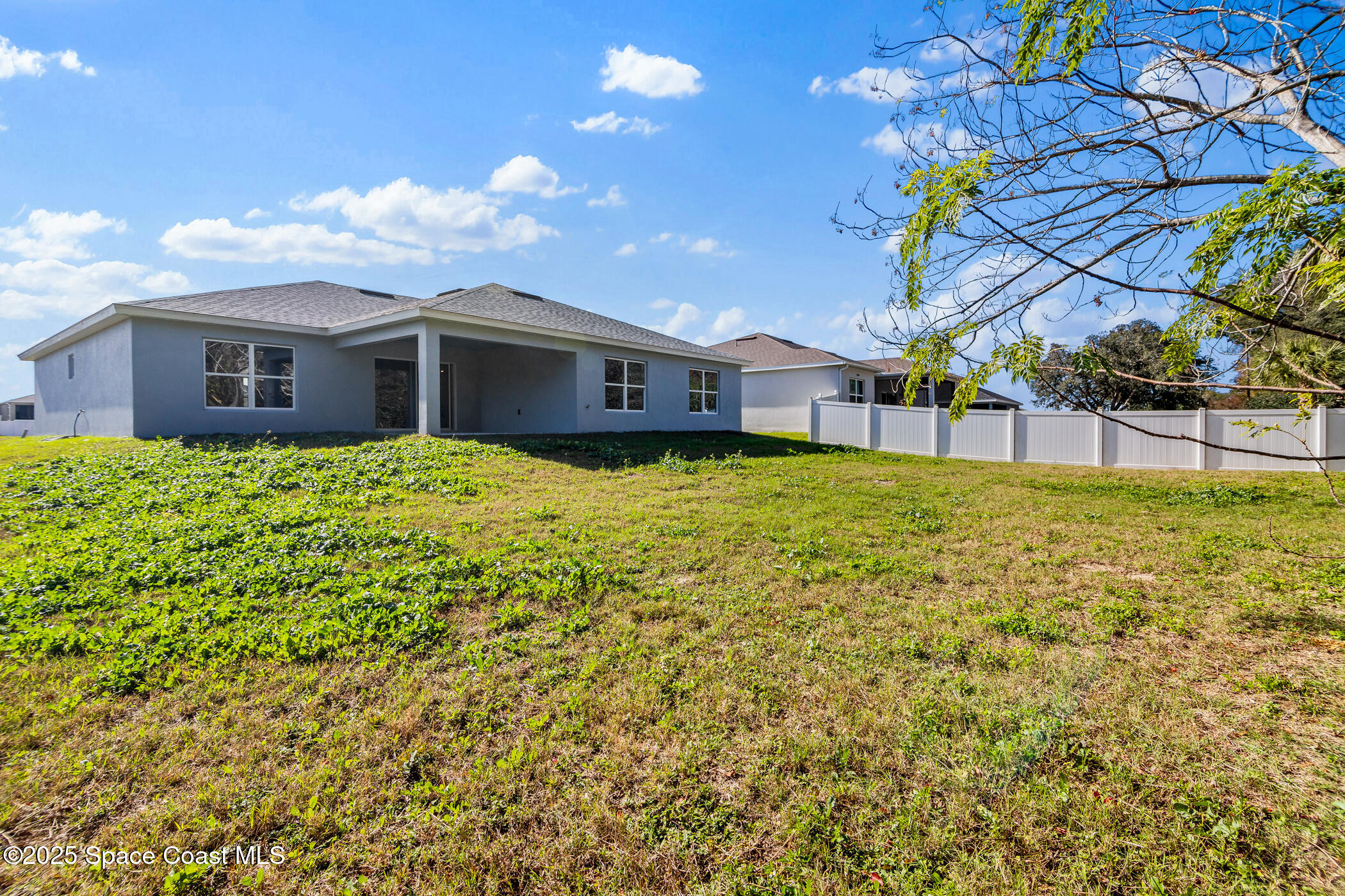 5435 Southeast 91st Street Ocala, FL 34480 - Photo 42 of 44 a house view with a garden space