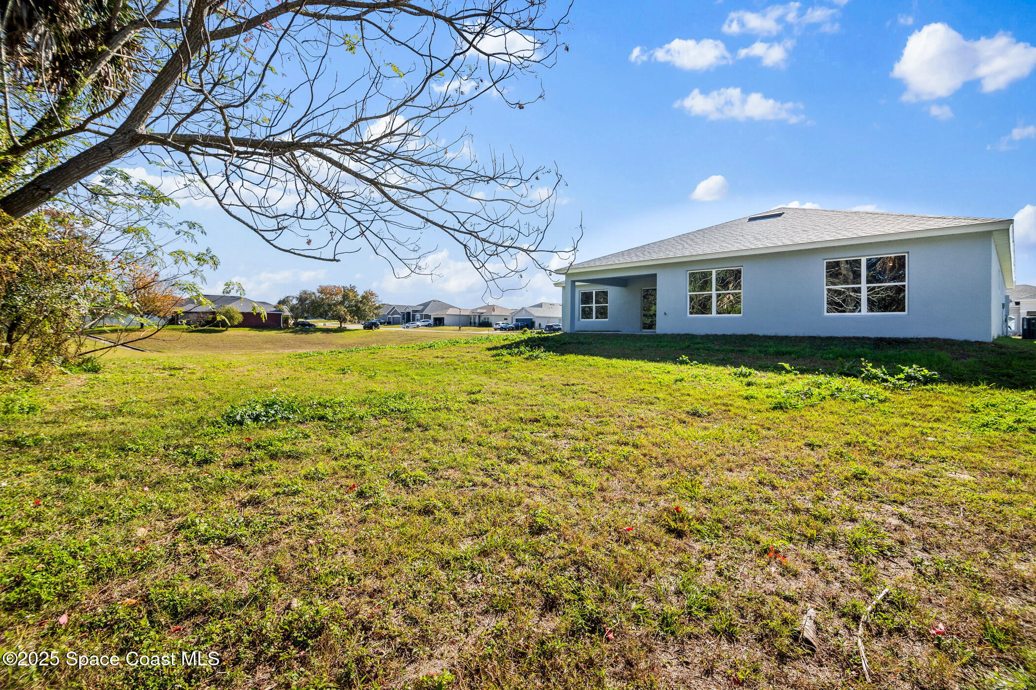 5435 Southeast 91st Street Ocala, FL 34480 - Photo 43 of 44 a view of a house with a yard