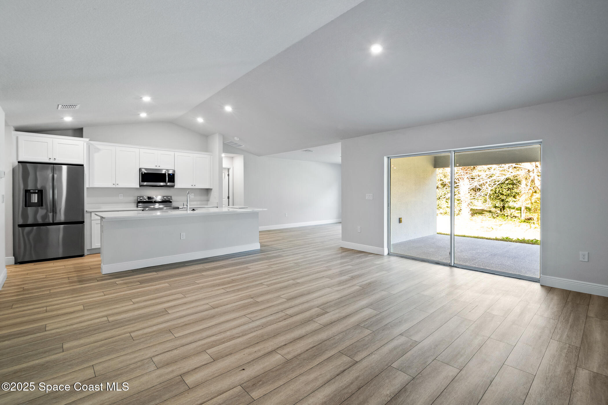 5435 Southeast 91st Street Ocala, FL 34480 - Photo 9 of 44 a view of a kitchen with a sink and a stove top oven