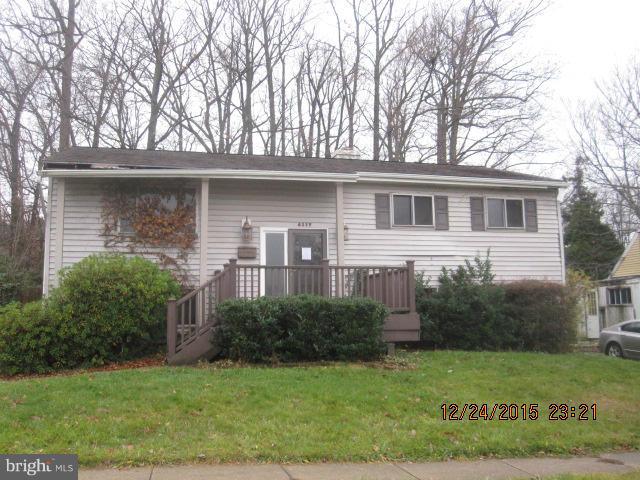 6117 Collinsway Road Catonsville, MD 21228 - Photo 1 of 11 a front view of a house with garden
