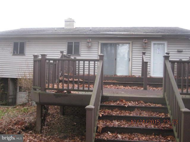 6117 Collinsway Road Catonsville, MD 21228 - Photo 2 of 11 a view of a house with a bench