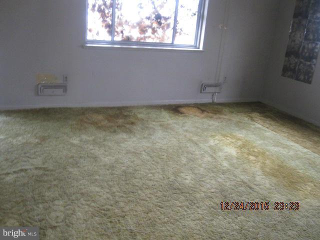 6117 Collinsway Road Catonsville, MD 21228 - Photo 4 of 11 an empty room with a window