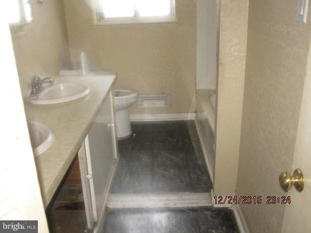 6117 Collinsway Road Catonsville, MD 21228 - Photo 6 of 11 a bathroom with a sink and a toilet
