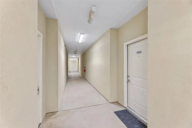a view of a hallway with white walls