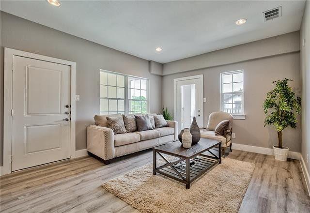 13609 Pinnacle Circle West, Unit 1101 Fort Worth, TX 76040 - Photo 5 of 21 a living room with furniture and wooden floor