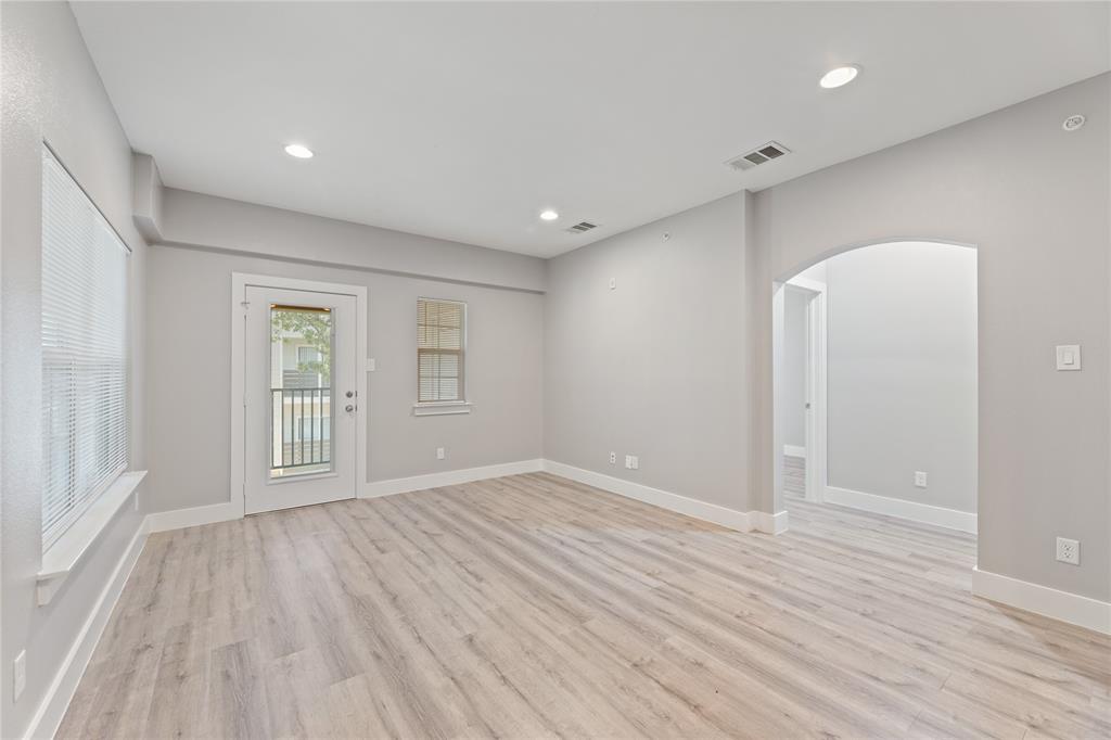 13609 Pinnacle Circle West, Unit 1101 Fort Worth, TX 76040 - Photo 6 of 21 wooden floor in an empty room with a window