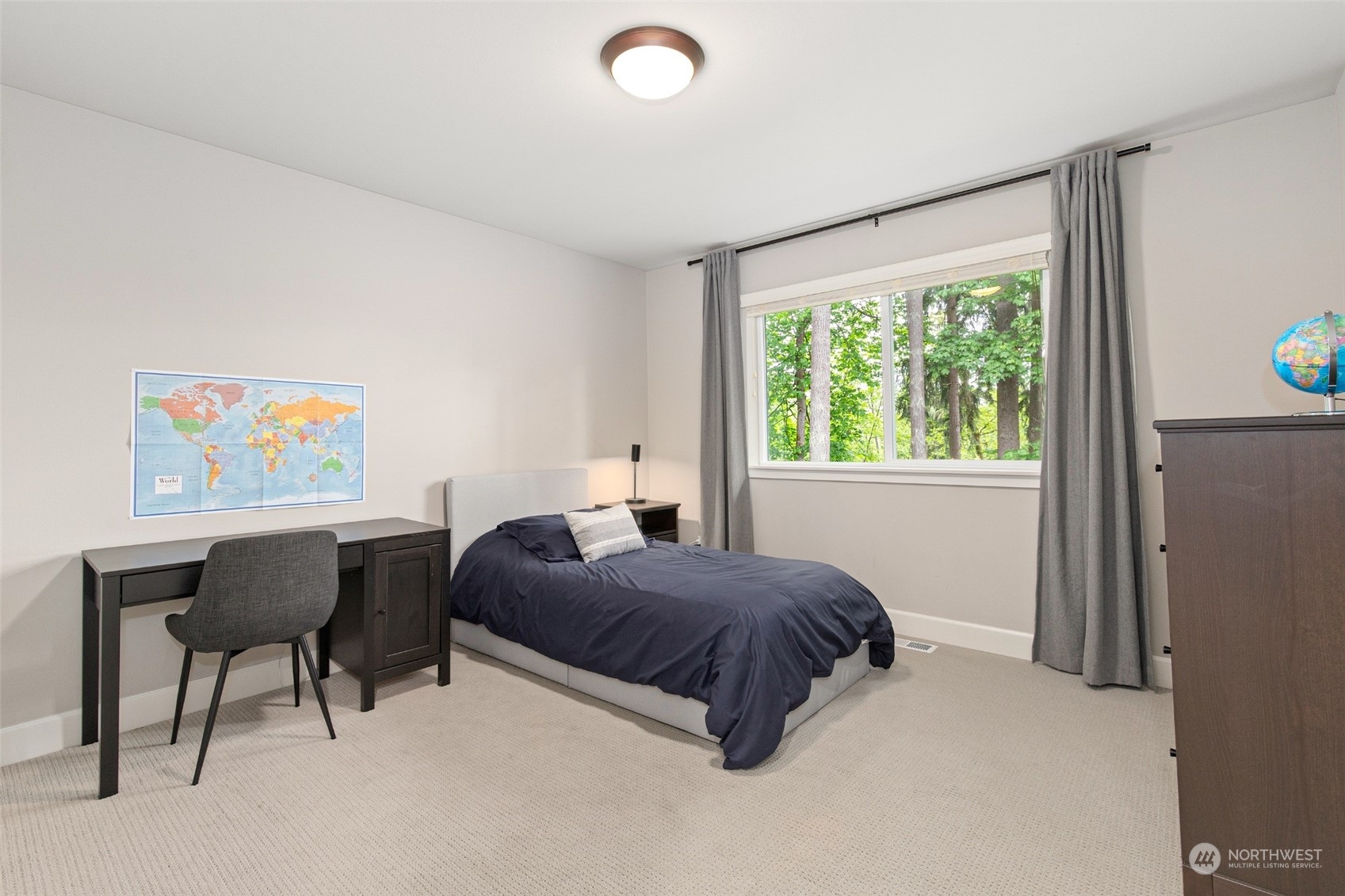 1607 233rd Street Southeast Bothell, WA 98021 - Photo 24 of 40 a living room with a bed furniture and a window