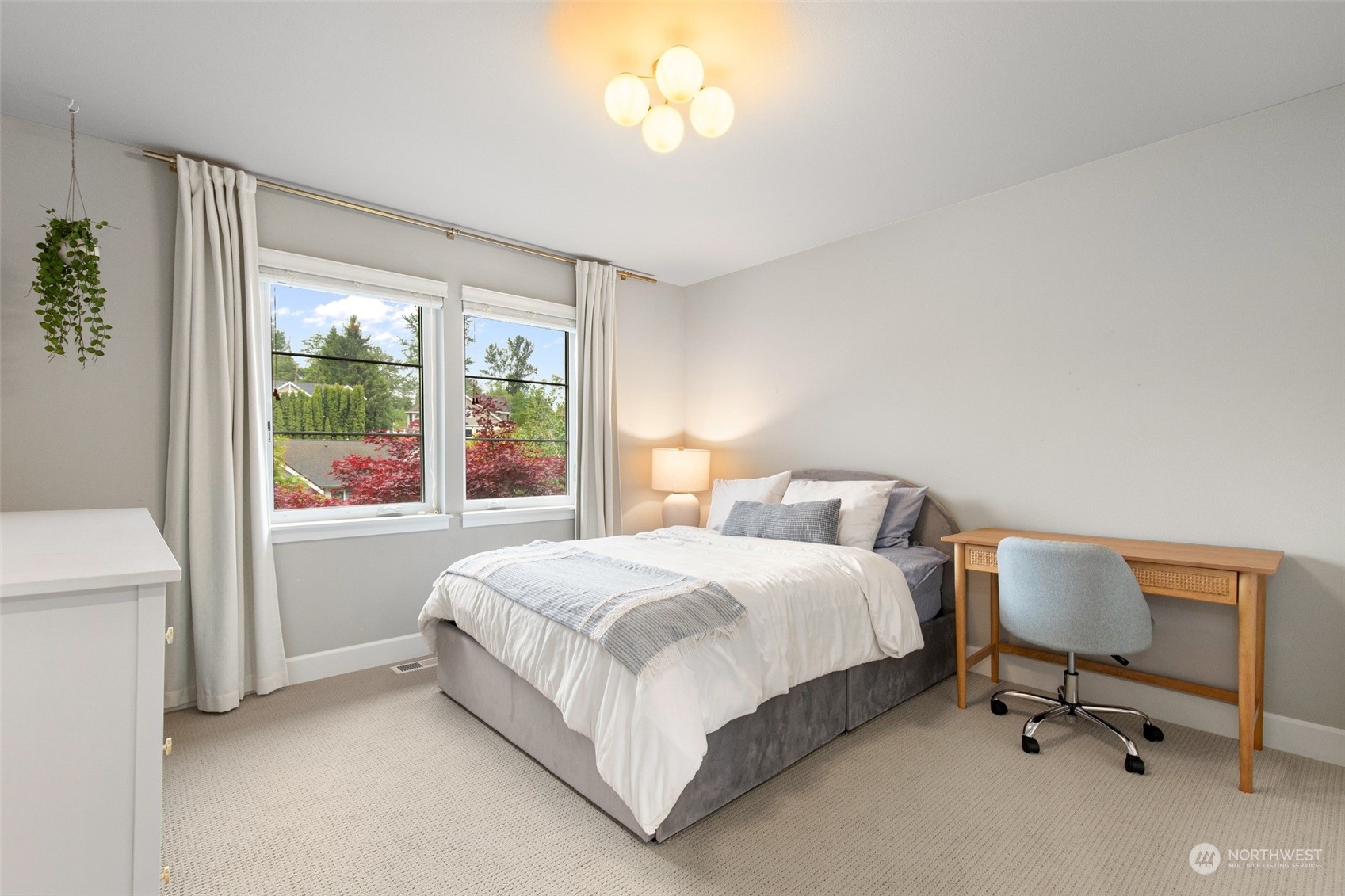 1607 233rd Street Southeast Bothell, WA 98021 - Photo 26 of 40 a bedroom with a bed and a table lamp