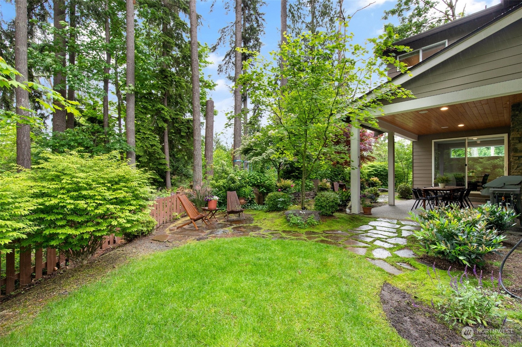 1607 233rd Street Southeast Bothell, WA 98021 - Photo 37 of 40 a view of a chair and table in backyard of the house