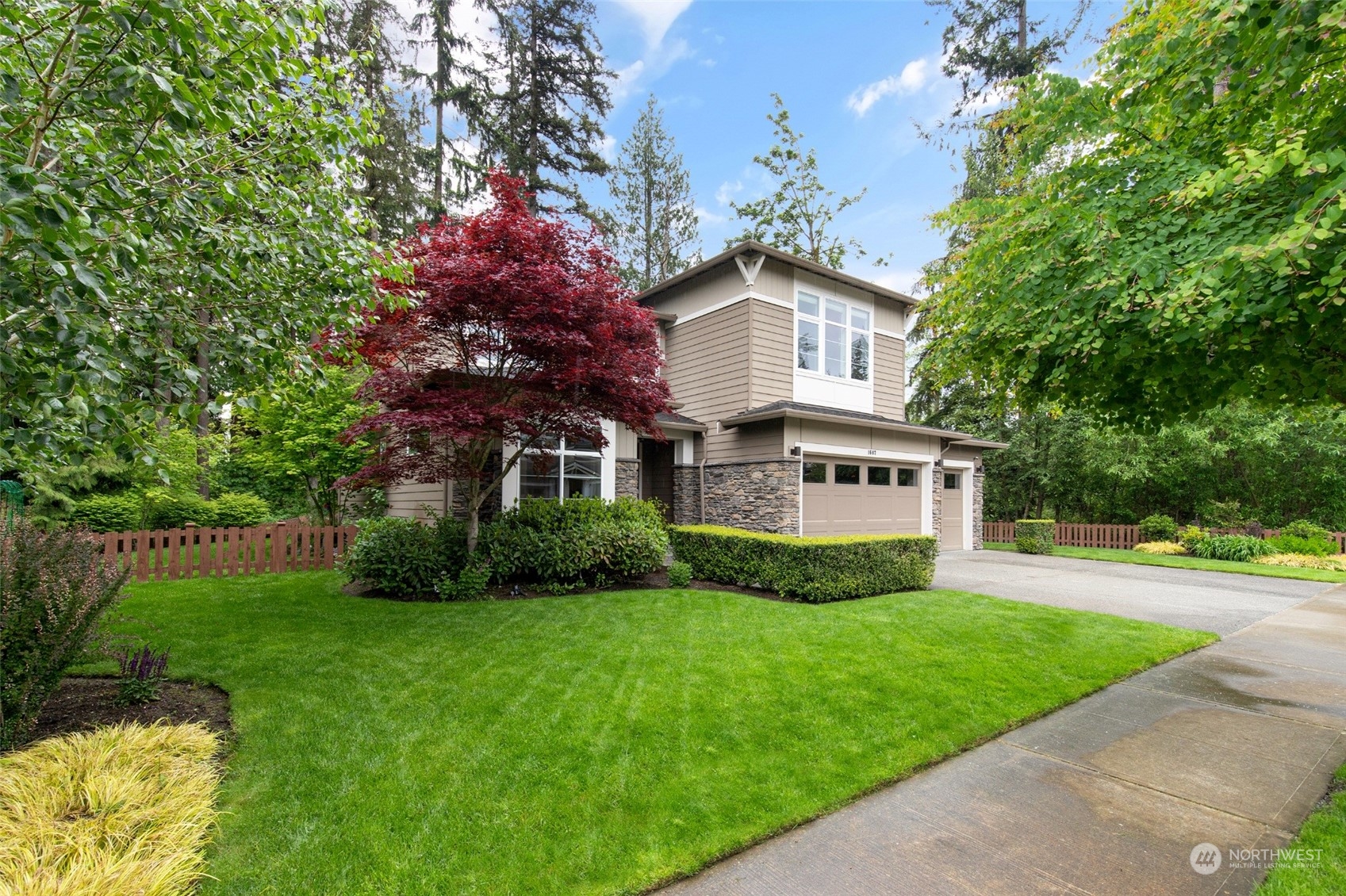 1607 233rd Street Southeast Bothell, WA 98021 - Photo 39 of 40 a view of a house with a big yard plants and large trees
