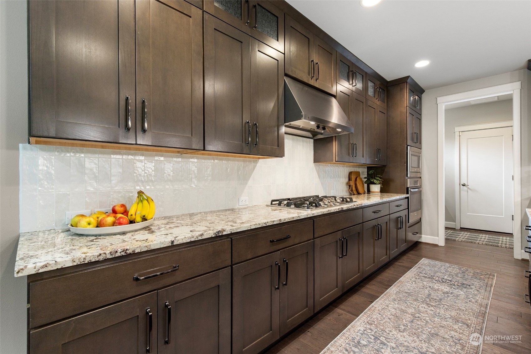 1607 233rd Street Southeast Bothell, WA 98021 - Photo 10 of 40 a kitchen with stainless steel appliances granite countertop a sink and cabinets