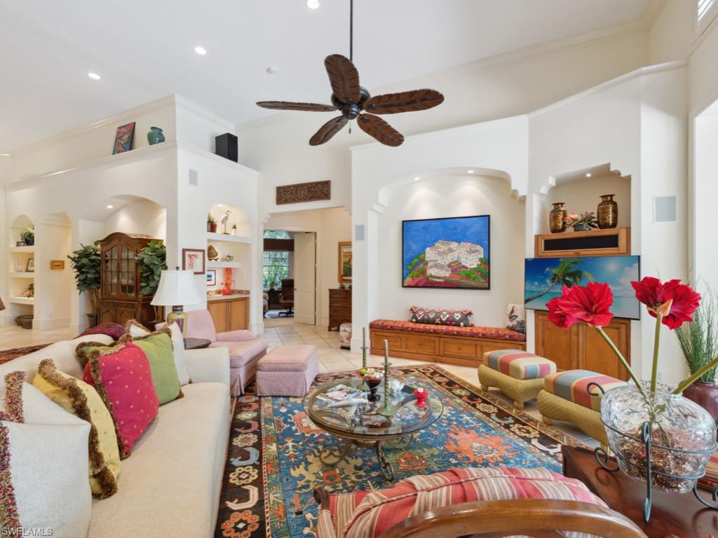 15352 Milan Lane Naples, FL 34110 - Photo 11 of 49 a living room with furniture and flowers