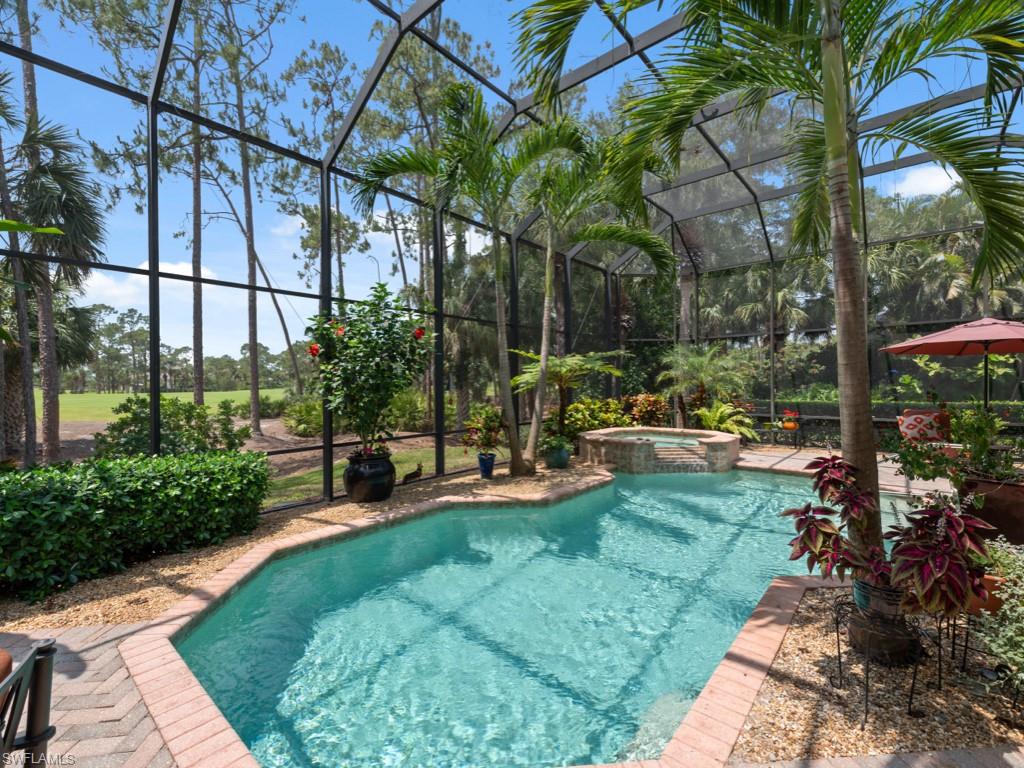 15352 Milan Lane Naples, FL 34110 - Photo 22 of 49 a view of a garden with patio