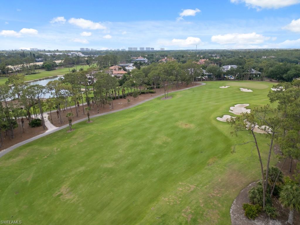 15352 Milan Lane Naples, FL 34110 - Photo 25 of 49 a view of a lake with a city