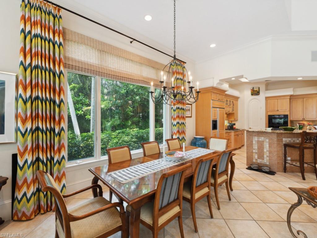 15352 Milan Lane Naples, FL 34110 - Photo 7 of 49 a view of a dining room with furniture window and outside view