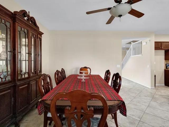 a bedroom with a bed and ceiling fan