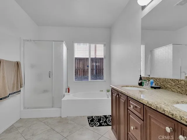 an empty room with windows and ceiling fan view