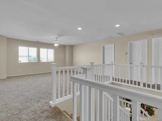 a white bath tub sitting next to a window