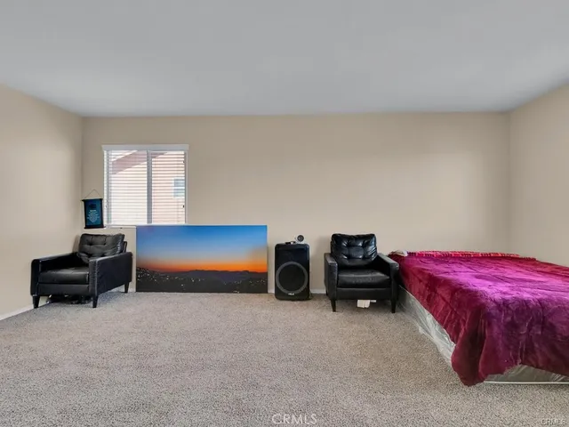 a bathroom with a toilet and a window