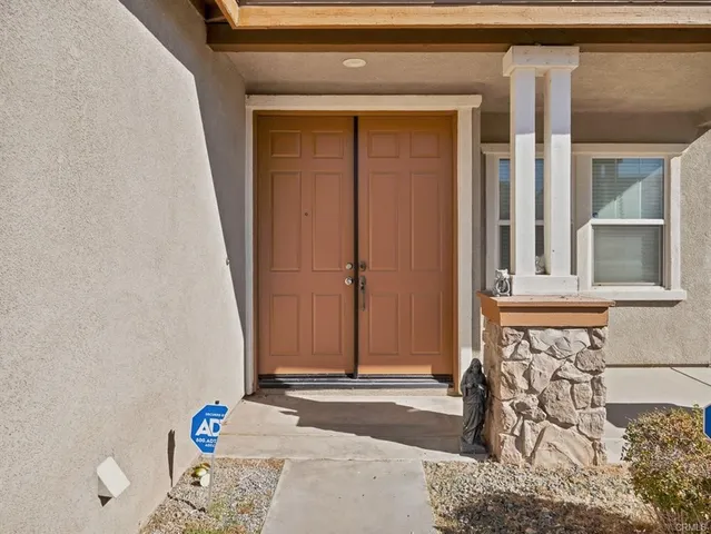a kitchen with stainless steel appliances granite countertop wooden cabinets sink and a granite counter top