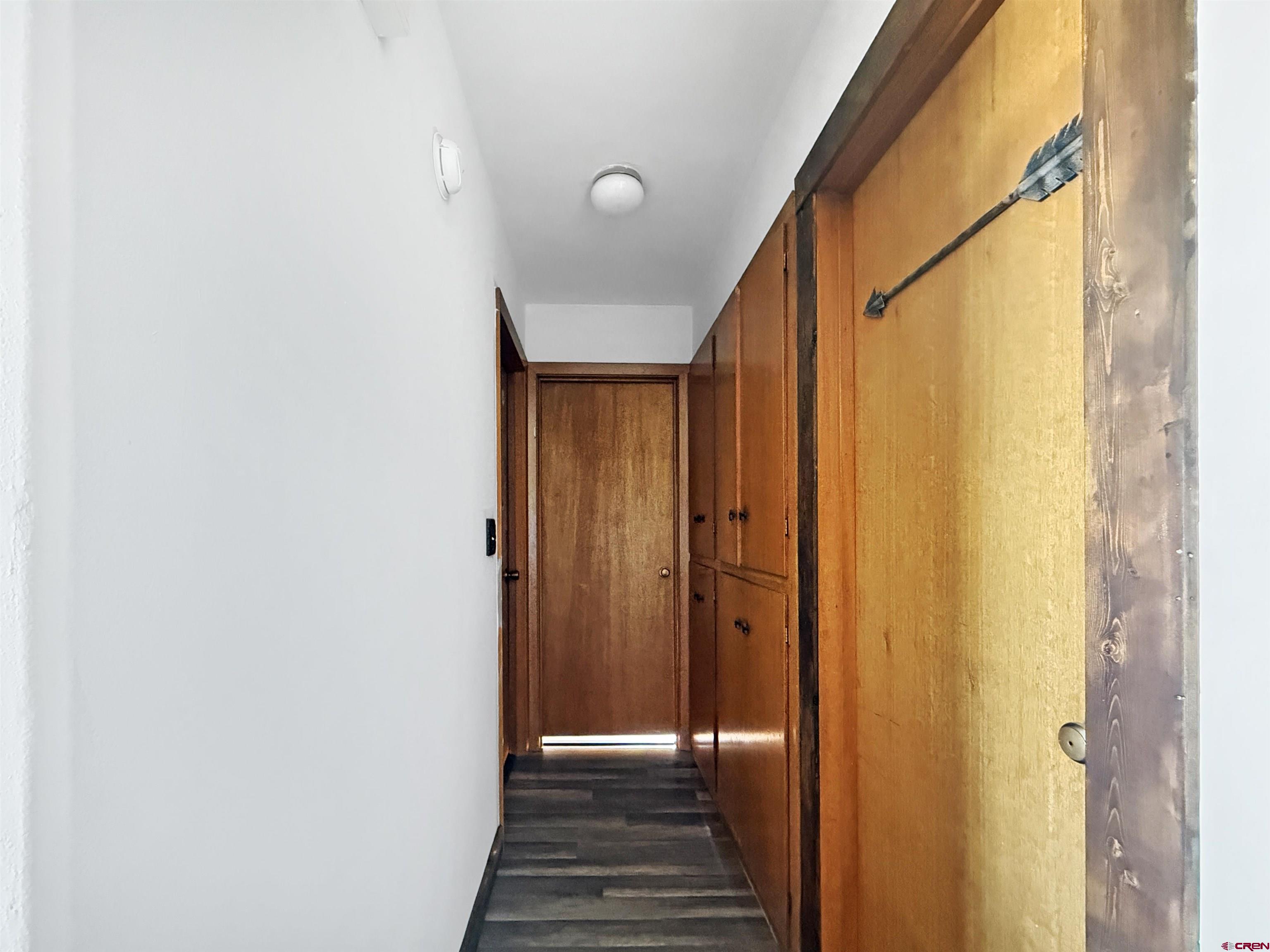10659 3100th Road Hotchkiss, CO 81419 - Photo 13 of 40 a view of a hallway with wooden floor and staircase