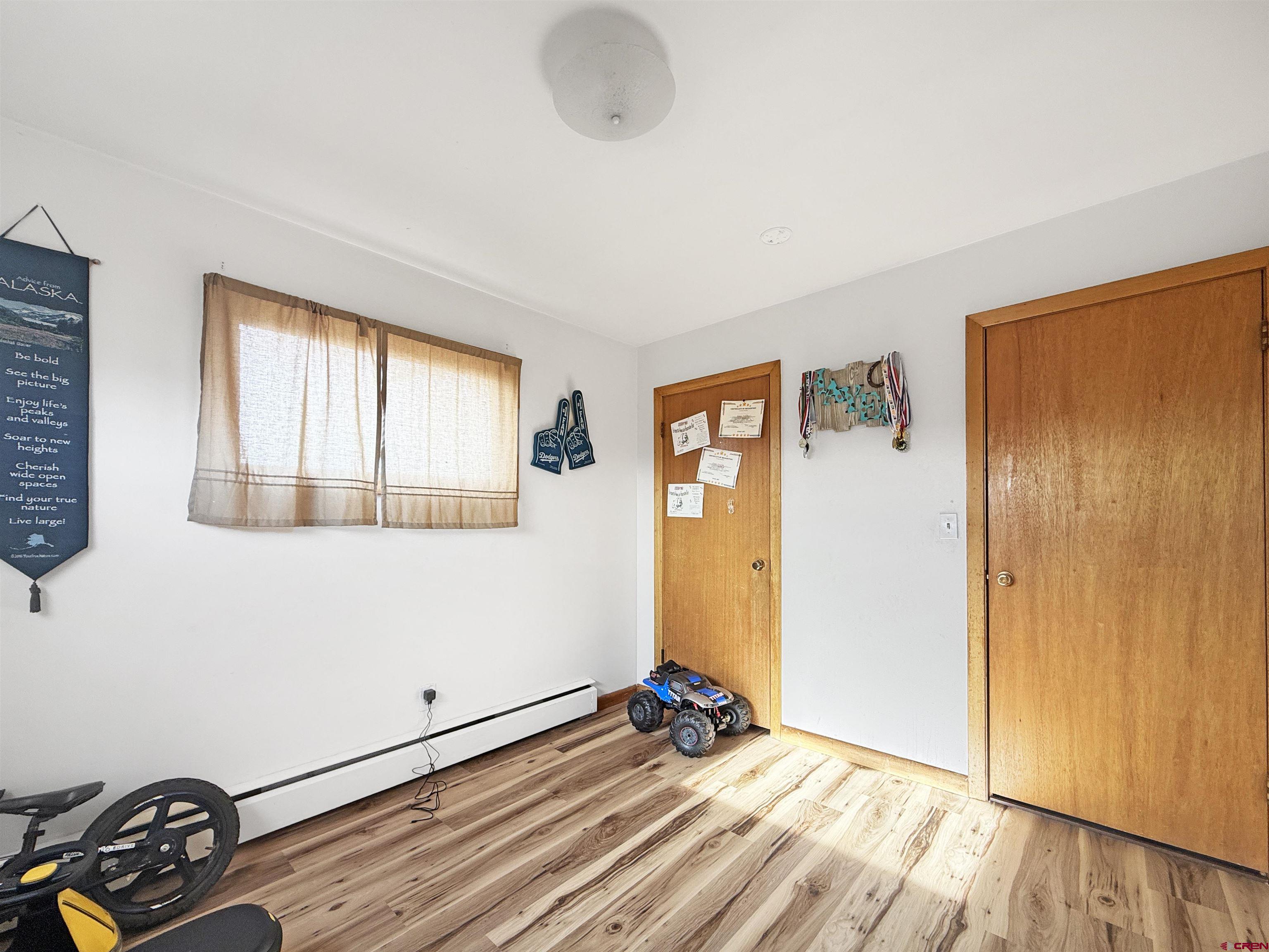 10659 3100th Road Hotchkiss, CO 81419 - Photo 16 of 40 a view of a room with wooden floor and windows