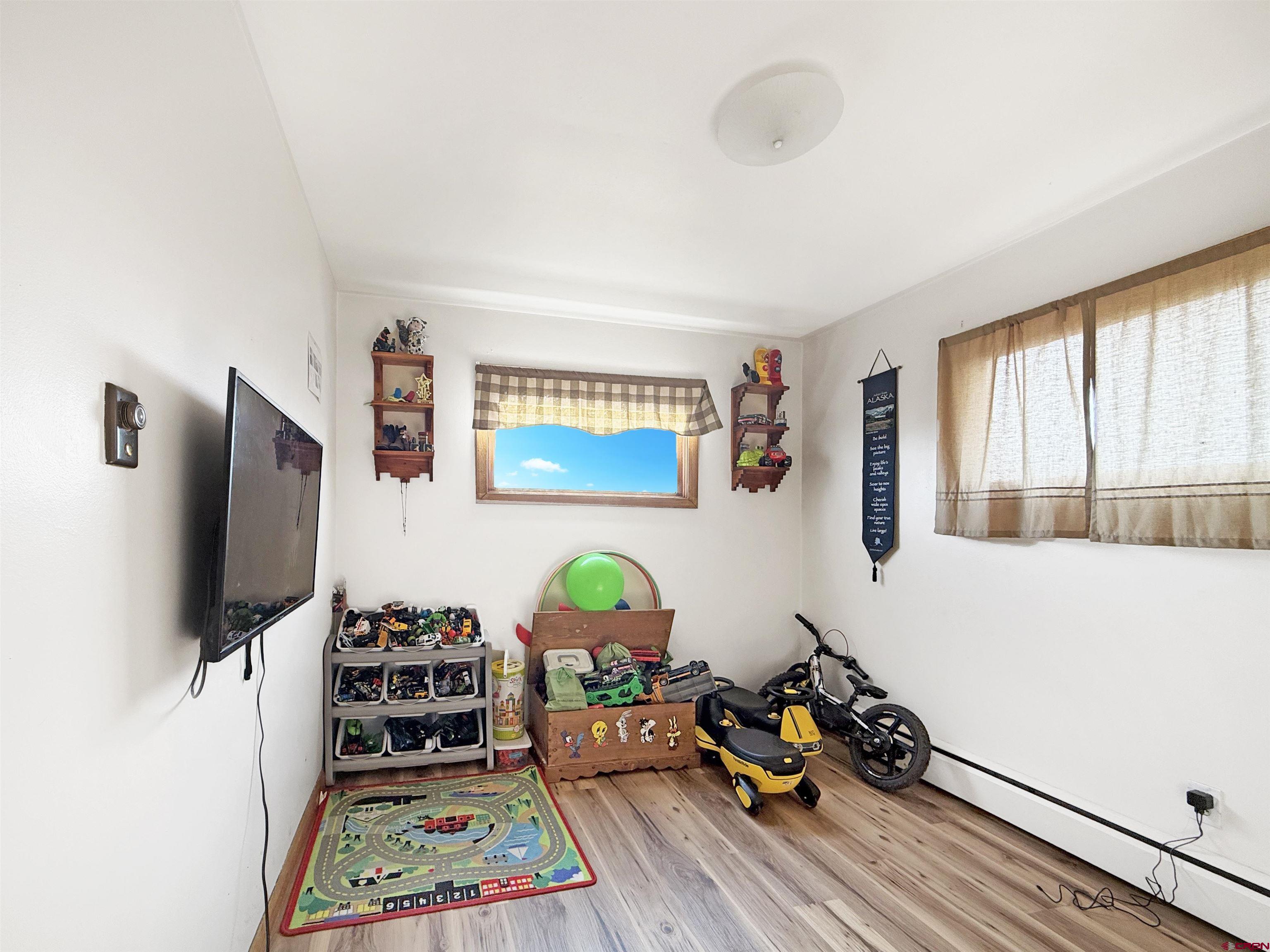 10659 3100th Road Hotchkiss, CO 81419 - Photo 17 of 40 a living room with furniture and a flat screen tv