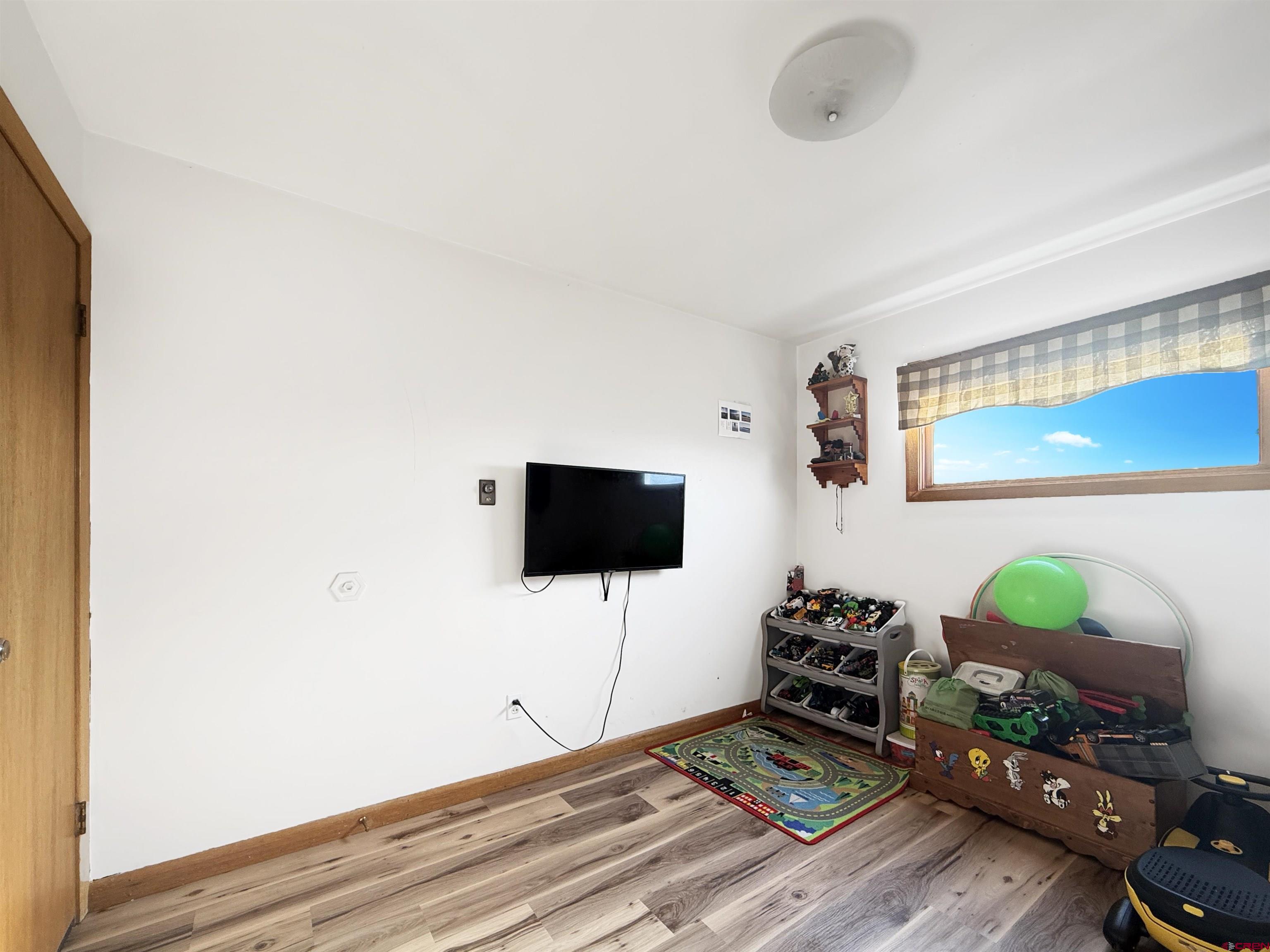 10659 3100th Road Hotchkiss, CO 81419 - Photo 18 of 40 a living room with furniture and a flat screen tv