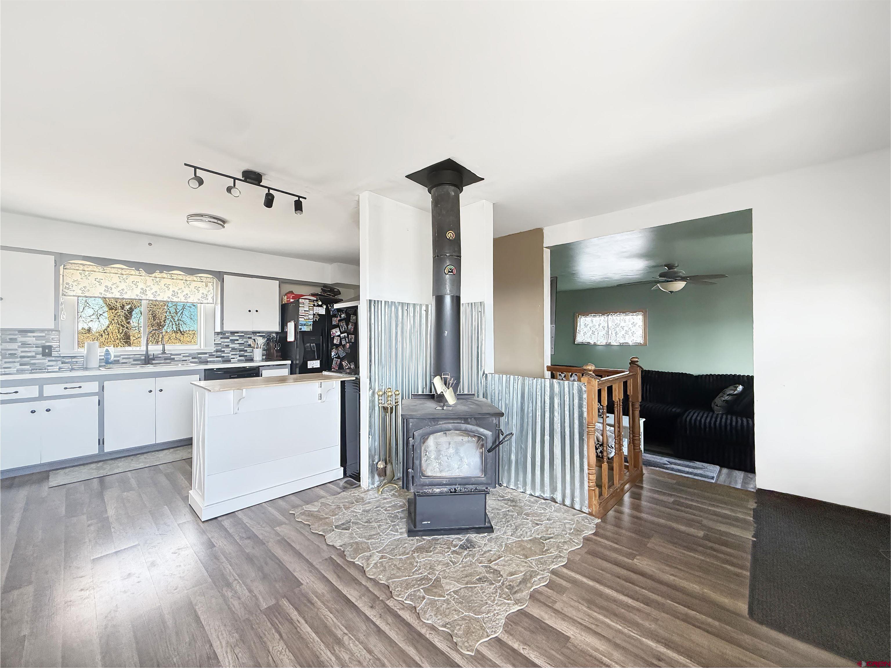 10659 3100th Road Hotchkiss, CO 81419 - Photo 2 of 40 a kitchen with white cabinets and sink