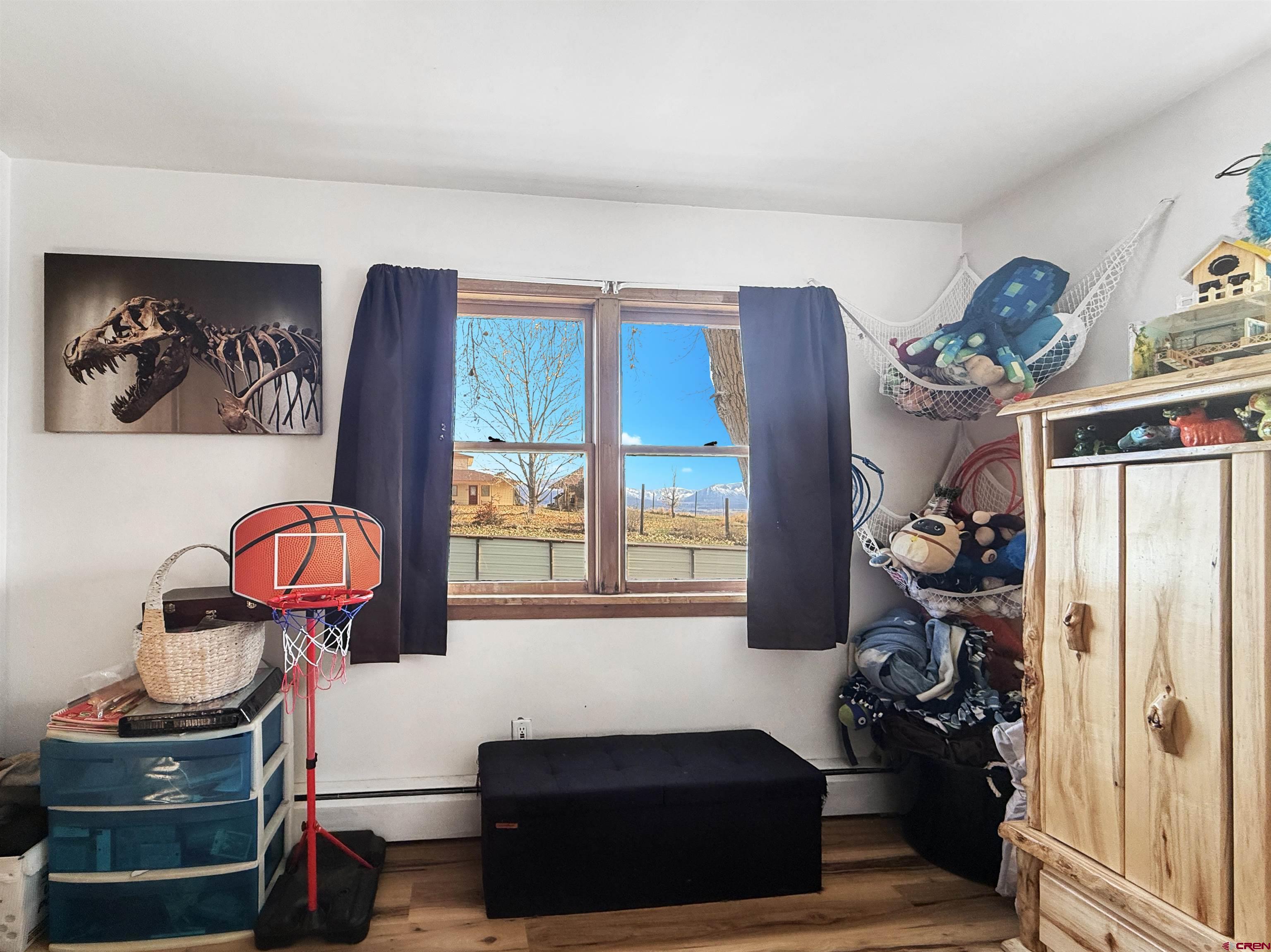 10659 3100th Road Hotchkiss, CO 81419 - Photo 21 of 40 a living room with furniture and a window