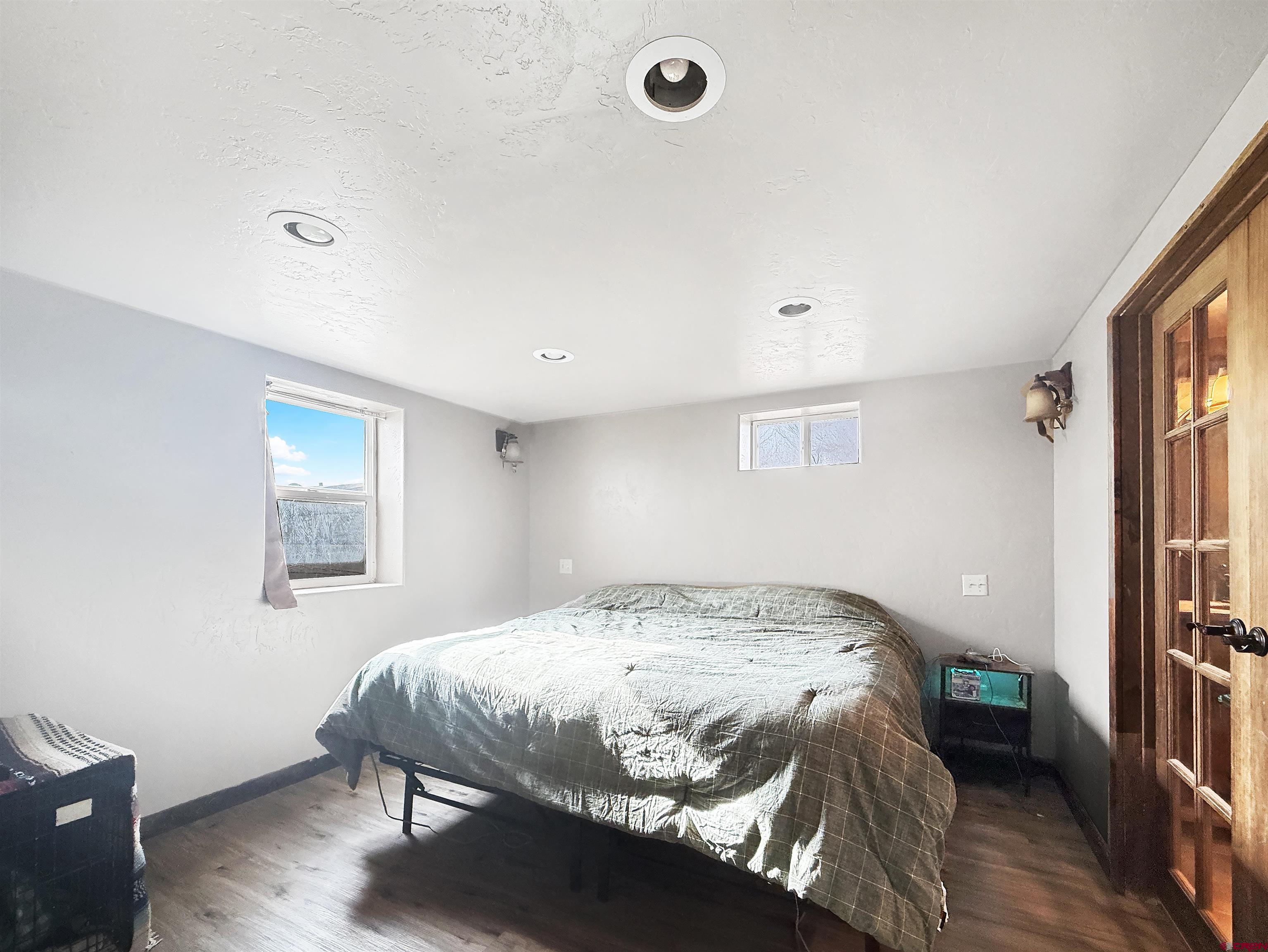 10659 3100th Road Hotchkiss, CO 81419 - Photo 27 of 40 a bedroom with a bed and a window