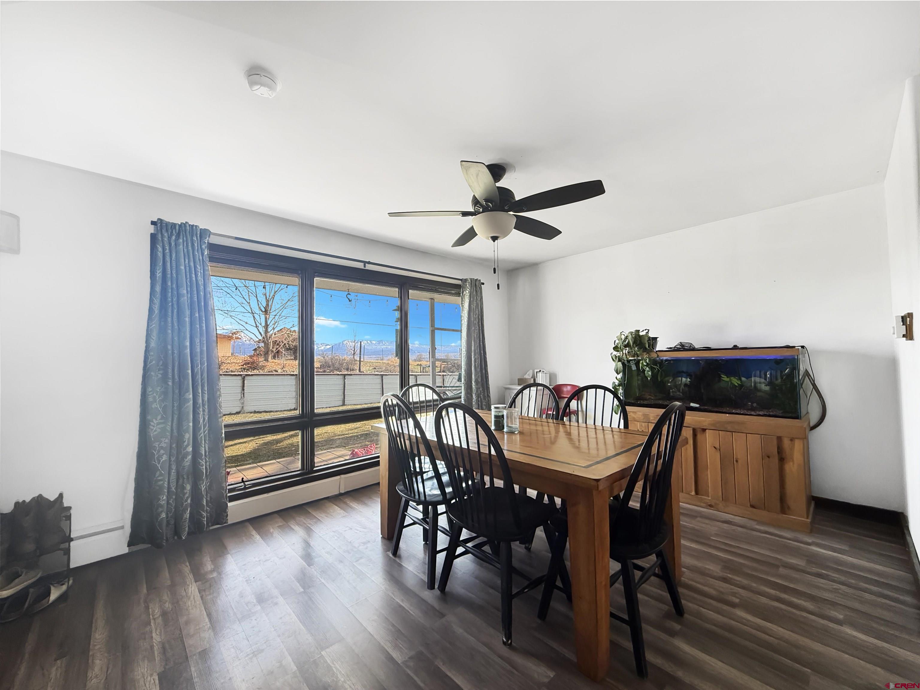 10659 3100th Road Hotchkiss, CO 81419 - Photo 3 of 40 a view of a dining room with furniture window and wooden floor