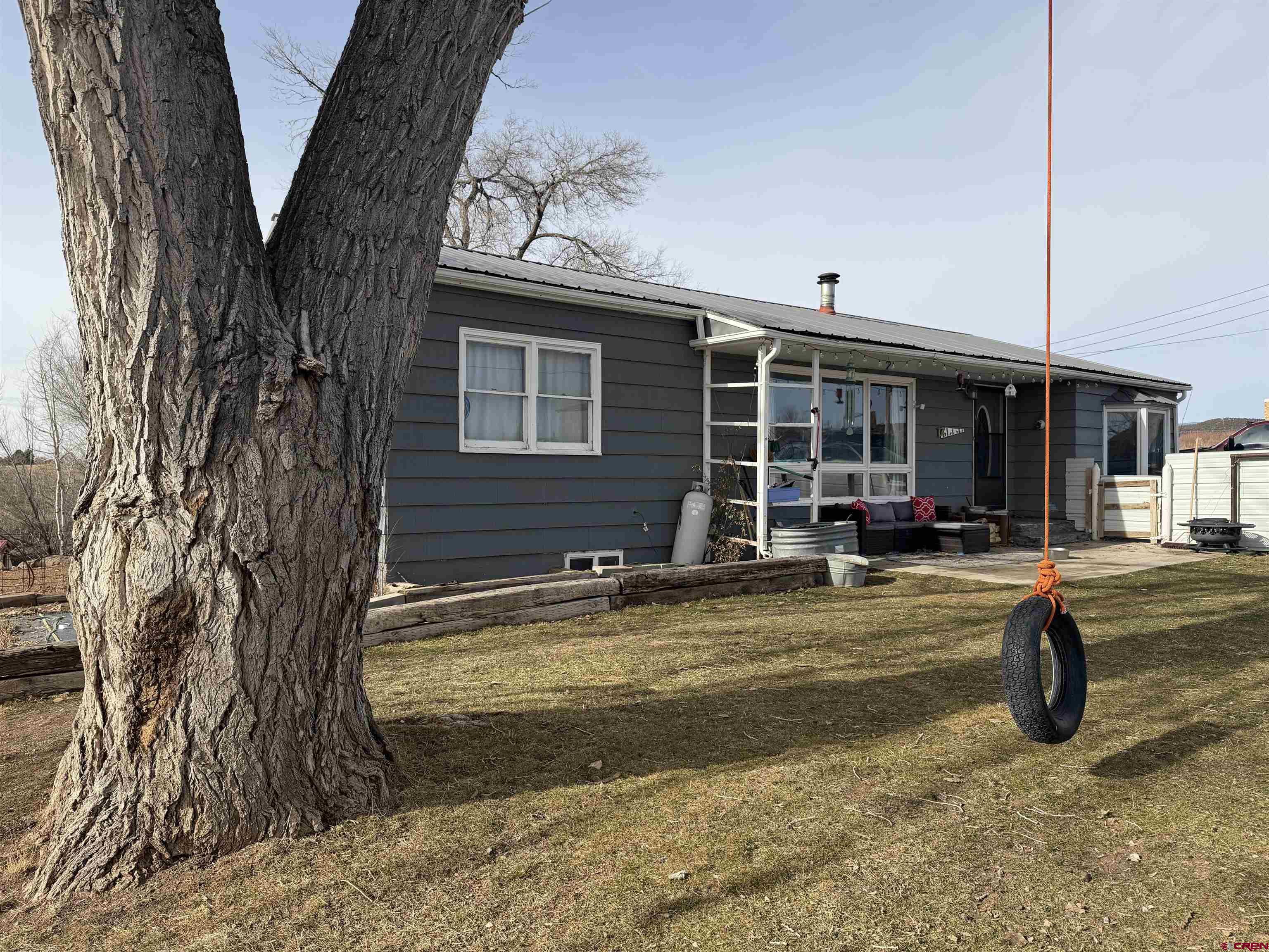 10659 3100th Road Hotchkiss, CO 81419 - Photo 33 of 40 a front view of a house with a yard