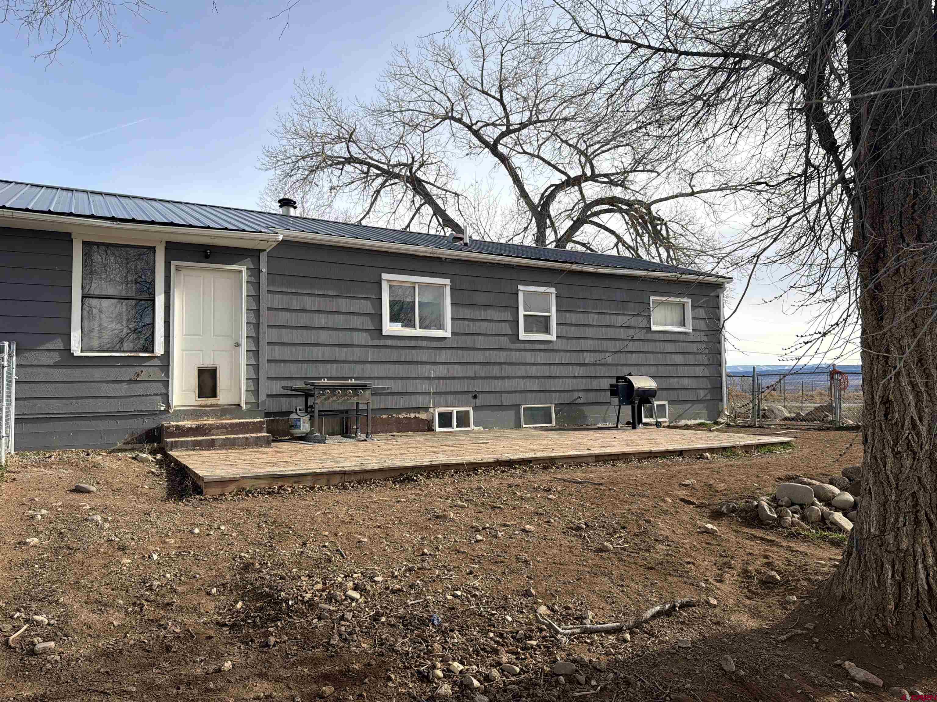 10659 3100th Road Hotchkiss, CO 81419 - Photo 39 of 40 a front view of a house with a yard