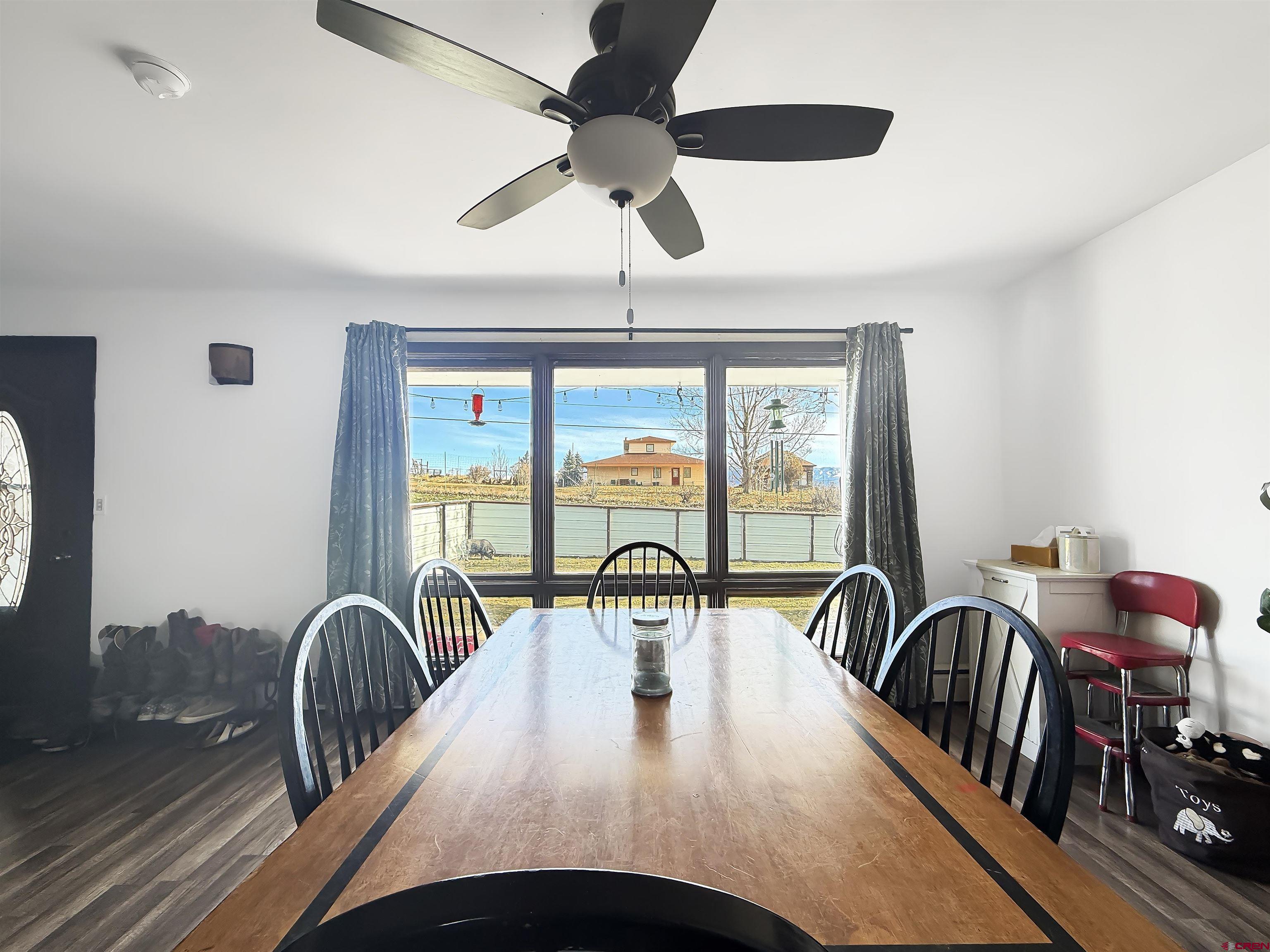 10659 3100th Road Hotchkiss, CO 81419 - Photo 4 of 40 a view of a dining room with furniture window and outside view