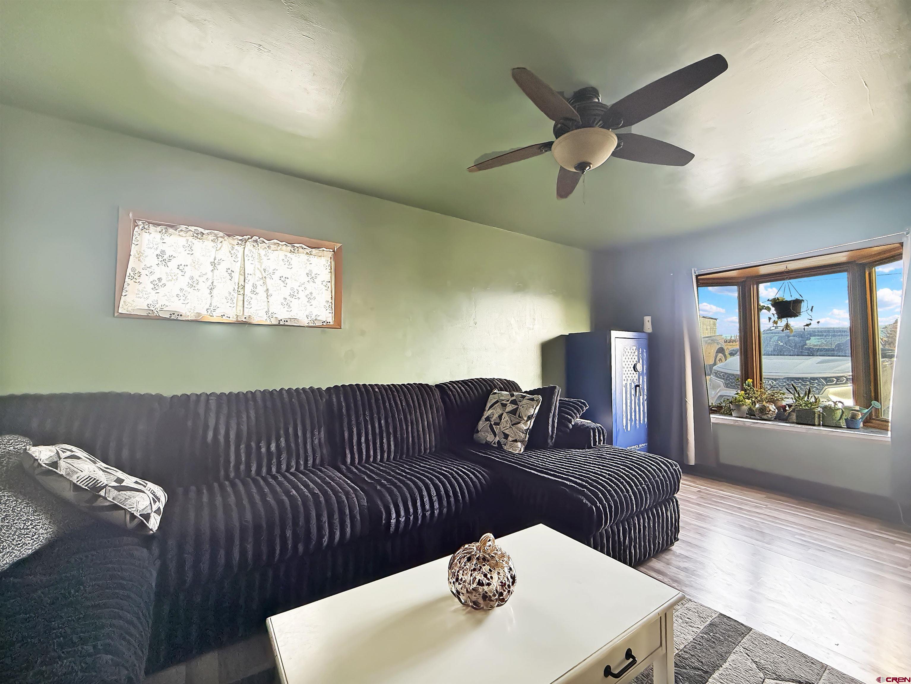 10659 3100th Road Hotchkiss, CO 81419 - Photo 9 of 40 a living room with furniture and window