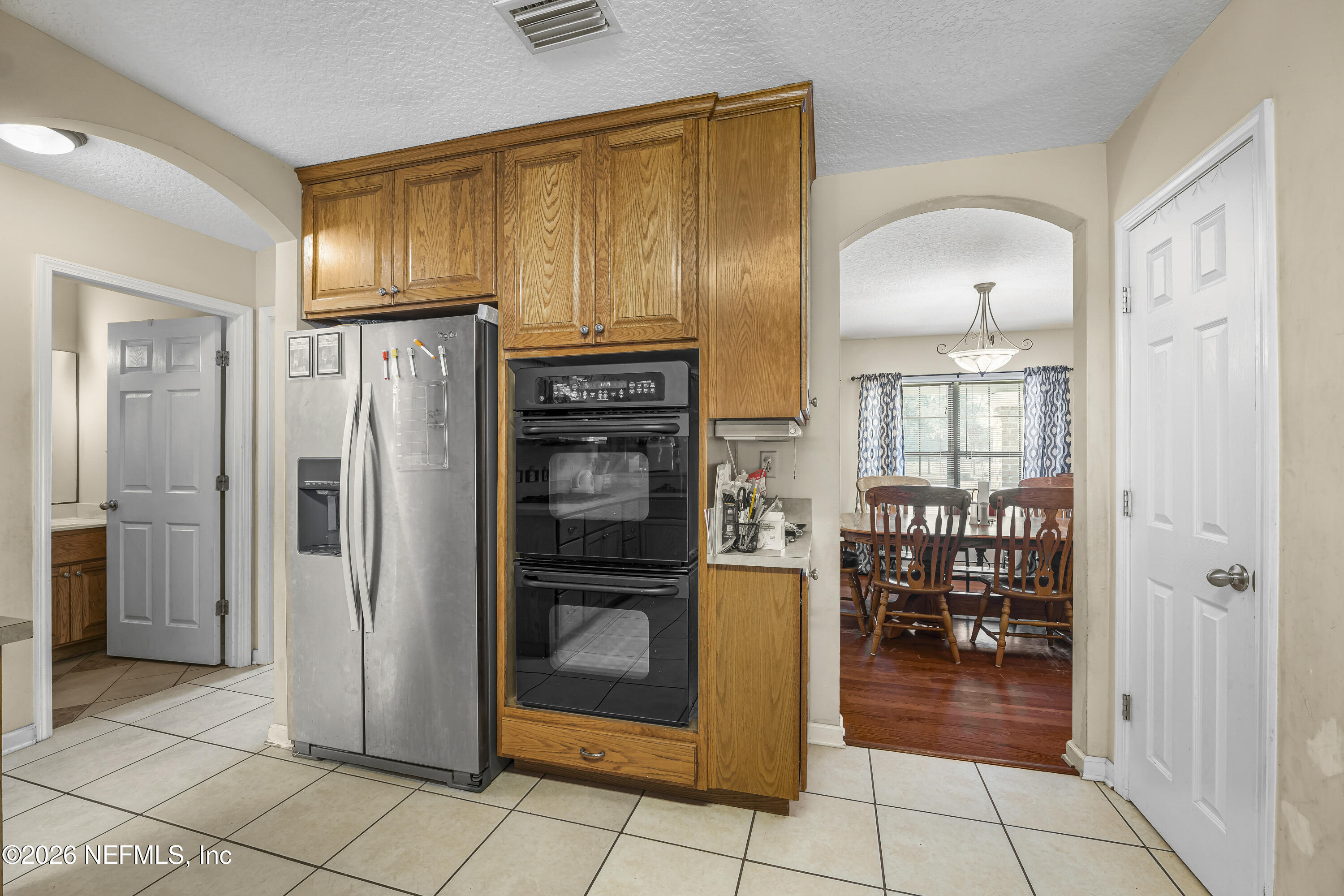 1725 Davidson Farm Road Jacksonville, FL 32218 - Photo 28 of 53 a kitchen with stainless steel appliances granite countertop a refrigerator and a sink