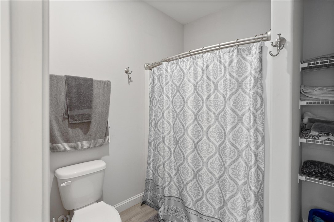 125 Estateside Drive Anderson, SC 29621 - Photo 18 of 37 A well-appointed bathroom offers a convenient toilet and shower area with ample storage.