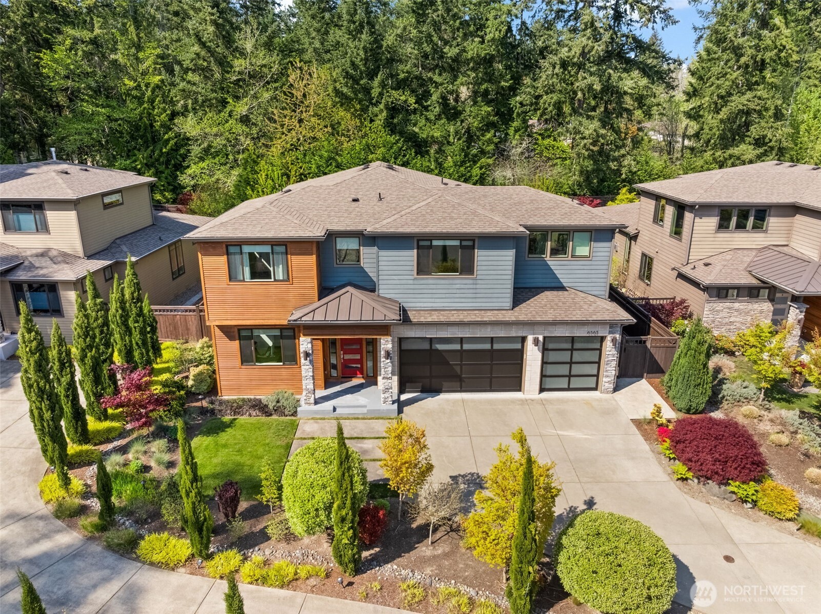 a view of a house with swimming pool lawn chairs and a yard